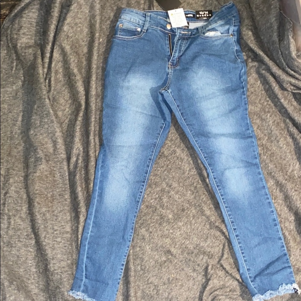 Denim Jeans with Distressed Ends